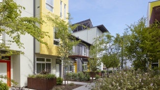 Walkway between buildings in village