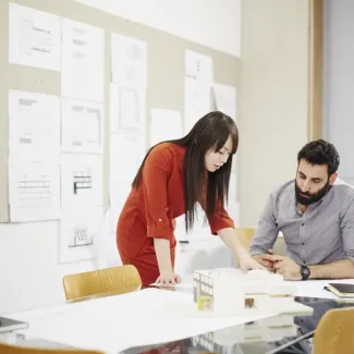 two people working together