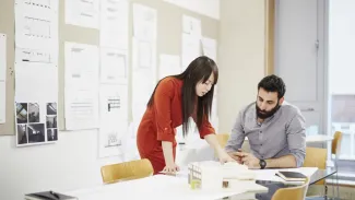 two people working together