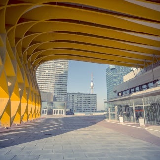 The Austria Center Vienna (ACV) - here the entrance - is Austria's largest convention center and is also one of Europe's most modern. It is used for conferences, exhibitions, corporate events and concerts. Skyscrapers in the background of the Danube and Danube tower can be seen.