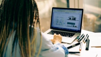 Woman at desk on her computer