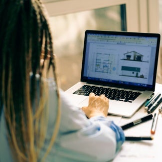Woman at desk on her computer