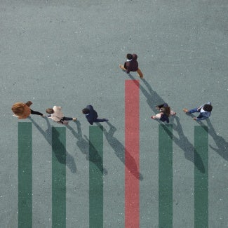 4 individuals walking even while 1 stands out above the rest