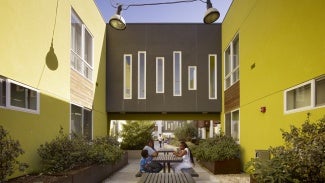 Common space between two yellow buildings