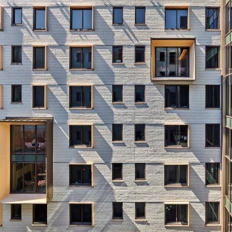 Courtyard East wall, from West, with pop-out study rooms.